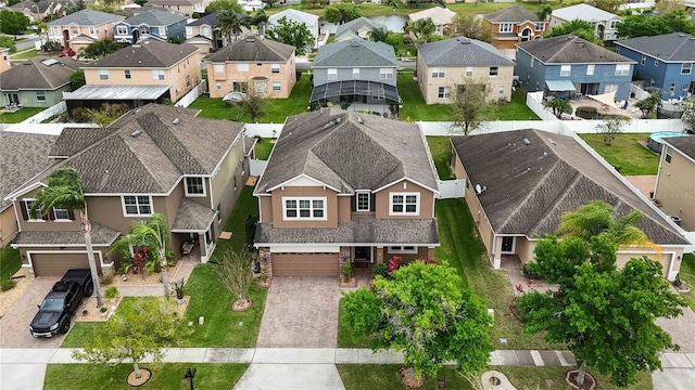 birds eye view of property with a residential view