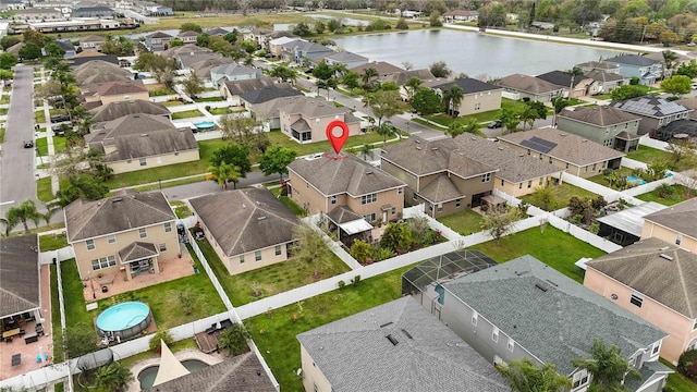 bird's eye view with a water view and a residential view