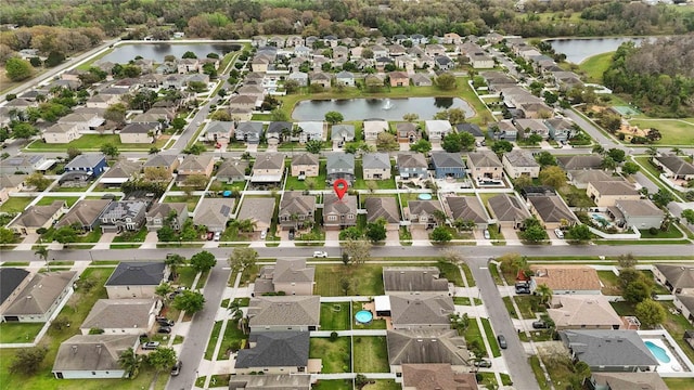 bird's eye view featuring a water view and a residential view