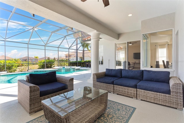 view of patio / terrace featuring ceiling fan, outdoor lounge area, a lanai, and a pool with connected hot tub