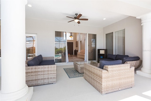 living room featuring recessed lighting, ceiling fan, and ornate columns