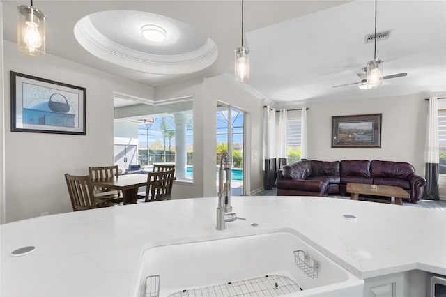 kitchen featuring open floor plan, visible vents, and pendant lighting