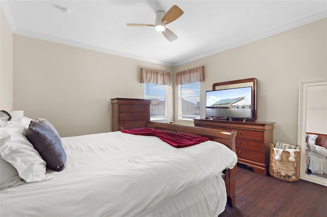 bedroom with ceiling fan, wood finished floors, and crown molding