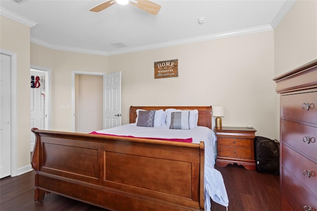 bedroom featuring ornamental molding, dark wood-style flooring, and ceiling fan