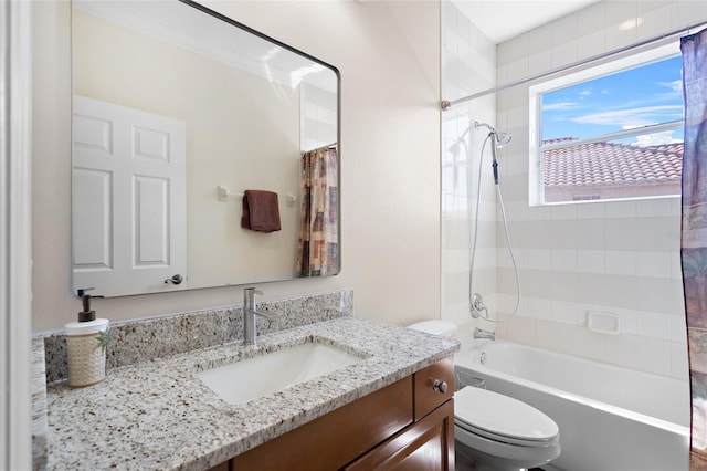 full bath with vanity, toilet, and shower / bath combo with shower curtain