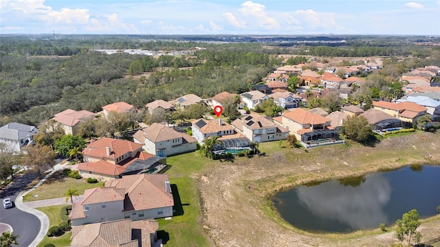 birds eye view of property with a residential view and a water view