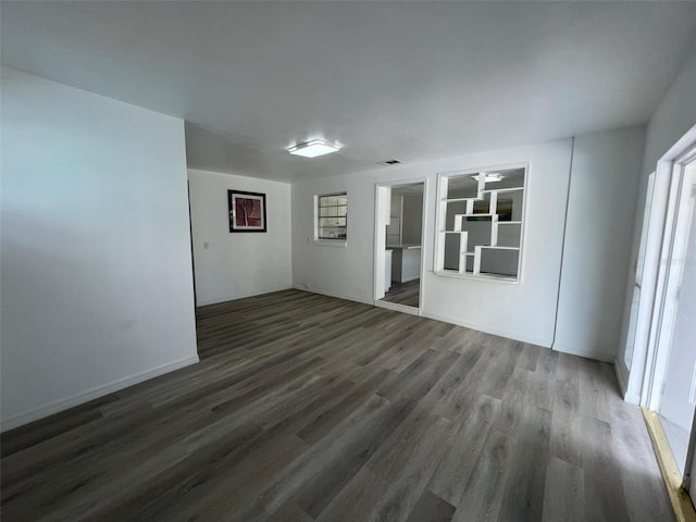 empty room with visible vents and wood finished floors