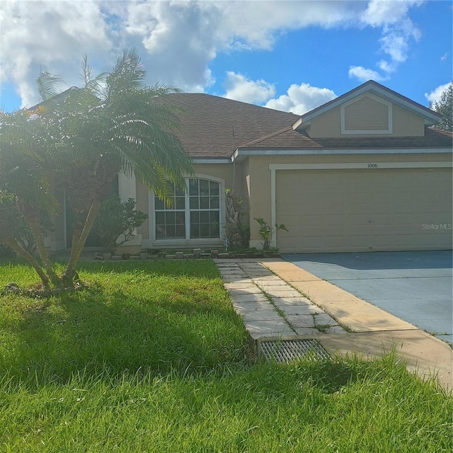 single story home featuring stucco siding, a front lawn, driveway, roof with shingles, and a garage