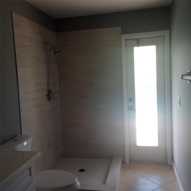 full bath with tile patterned floors, vanity, toilet, and a shower stall