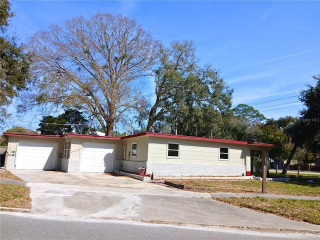 single story home featuring driveway and an attached garage