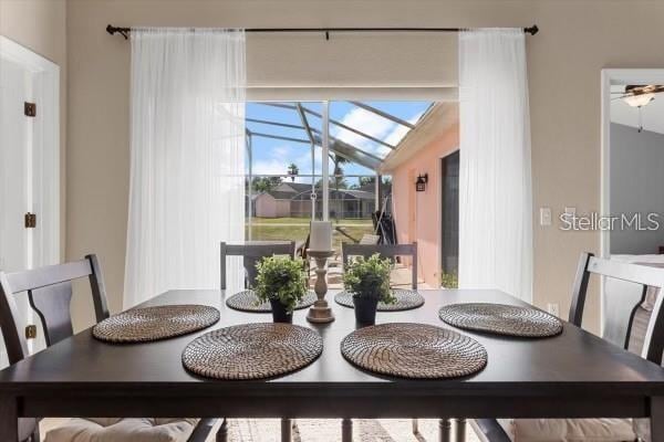 dining room with a sunroom