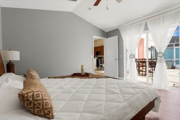 bedroom featuring access to outside, vaulted ceiling, and ceiling fan