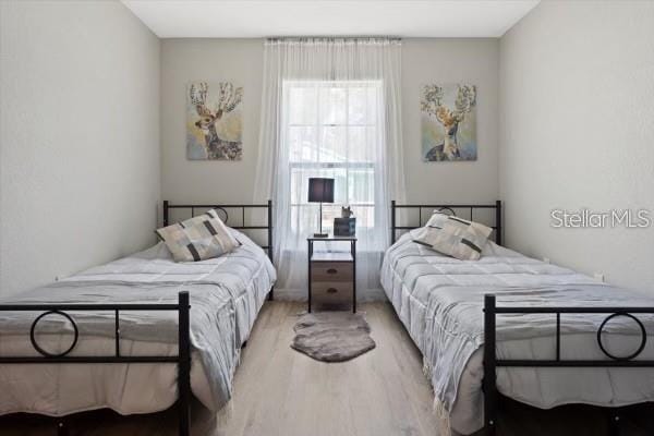 bedroom with wood finished floors