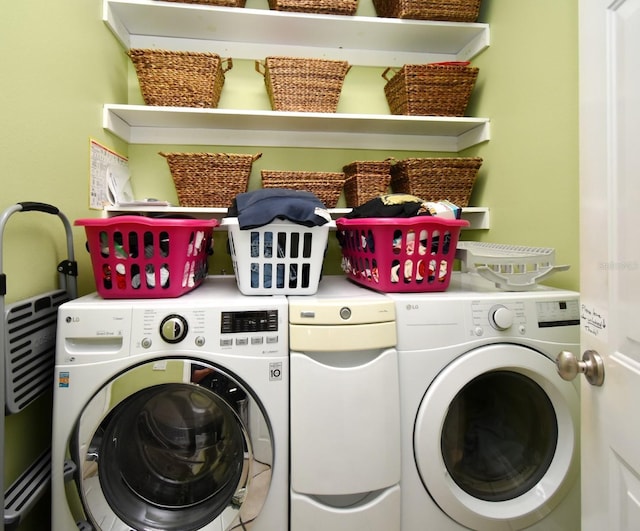 washroom with washer and dryer and laundry area