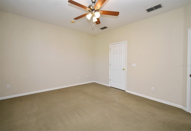 spare room featuring visible vents, baseboards, carpet, and ceiling fan