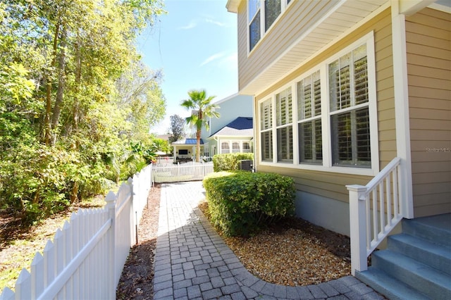 view of side of home with fence