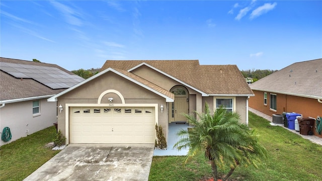 view of front facade featuring an attached garage, driveway, a front lawn, and stucco siding