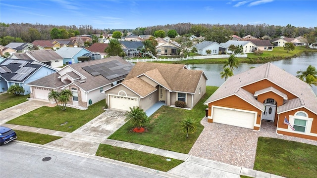 aerial view with a water view and a residential view