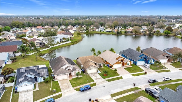 aerial view featuring a water view and a residential view