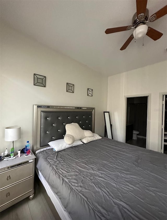 bedroom featuring ceiling fan and dark wood-style flooring