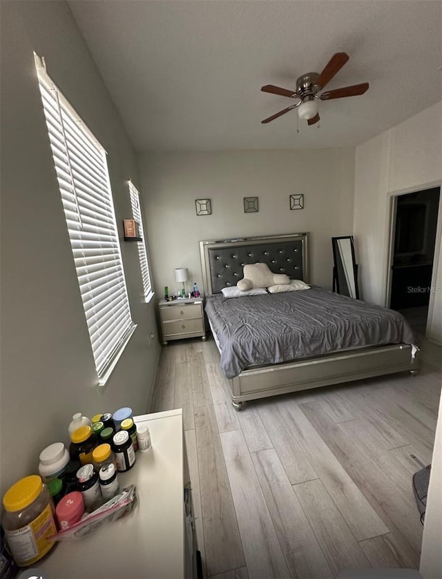 bedroom with wood finished floors and a ceiling fan