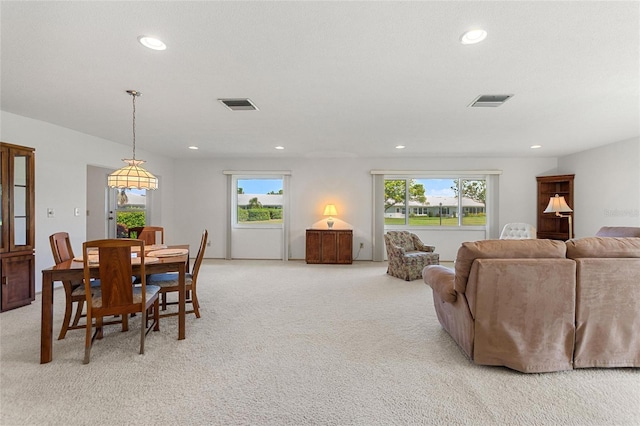 dining room featuring light carpet, visible vents, and recessed lighting