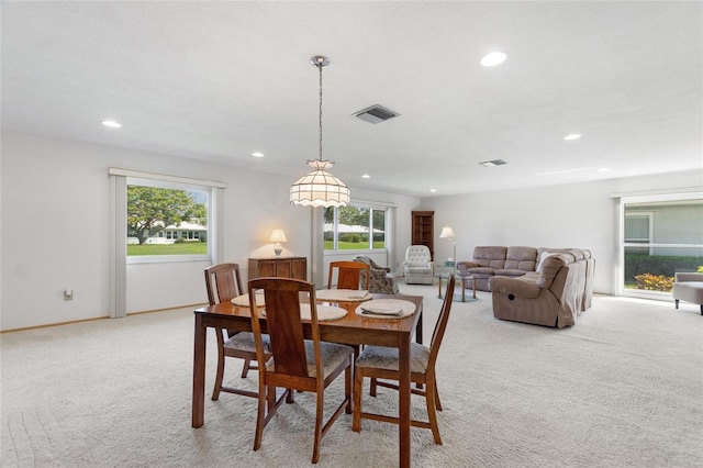 dining room featuring light carpet, baseboards, visible vents, and recessed lighting