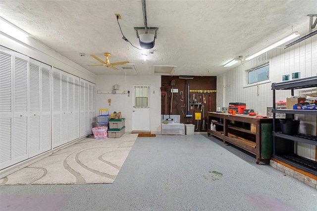 garage featuring a workshop area and a garage door opener