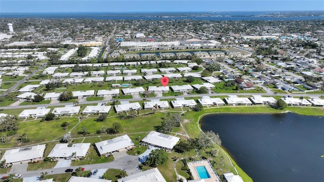 bird's eye view featuring a residential view and a water view