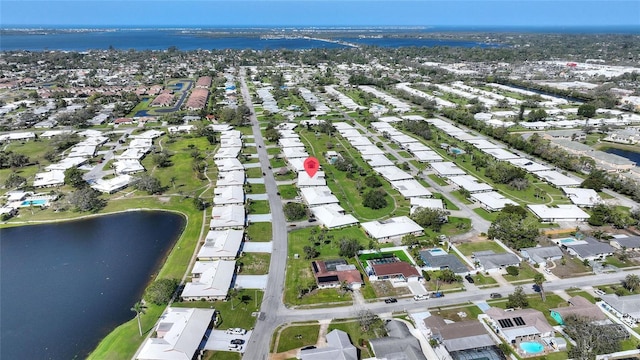 birds eye view of property featuring a water view and a residential view