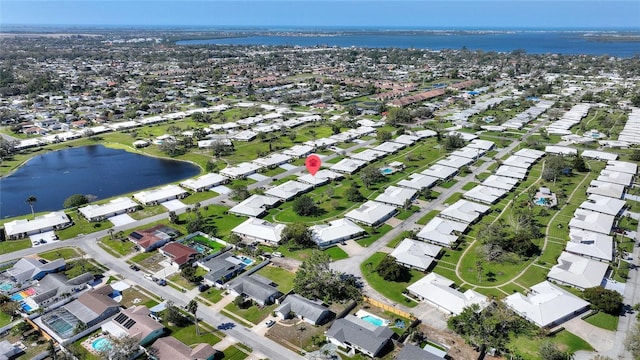 aerial view with a water view and a residential view