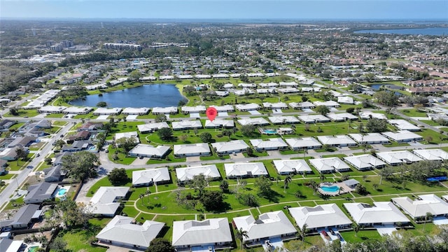 drone / aerial view with a water view and a residential view