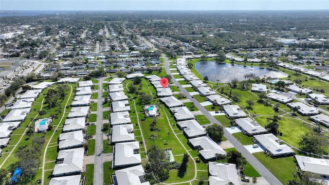 birds eye view of property with a water view and a residential view