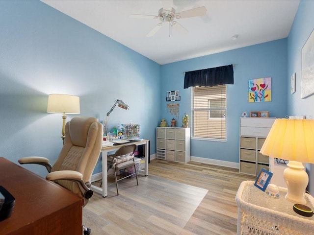 home office with ceiling fan, baseboards, and wood finished floors