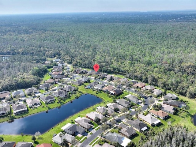 bird's eye view with a view of trees, a residential view, and a water view