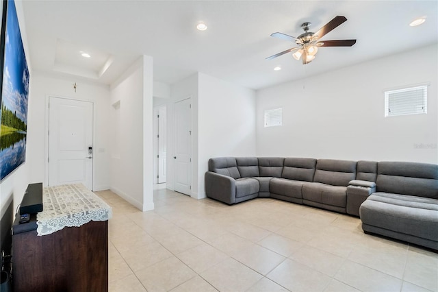 living room with a ceiling fan, light tile patterned floors, recessed lighting, and baseboards