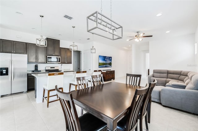 dining space with light tile patterned floors, recessed lighting, visible vents, and ceiling fan