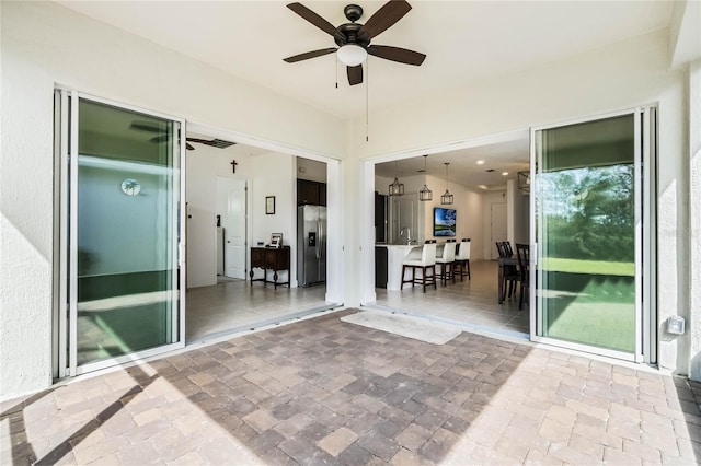 view of patio / terrace featuring ceiling fan