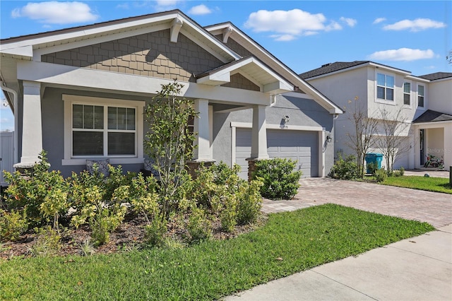 7793 Clove Hitch Way, Orlando, FL 32832 - view of front of house with a garage, decorative driveway, and stucco siding