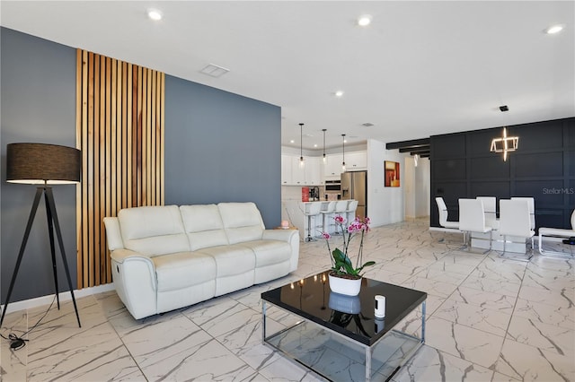 7793 Clove Hitch Way, Orlando, FL 32832 - living room featuring marble finish floor, baseboards, and recessed lighting