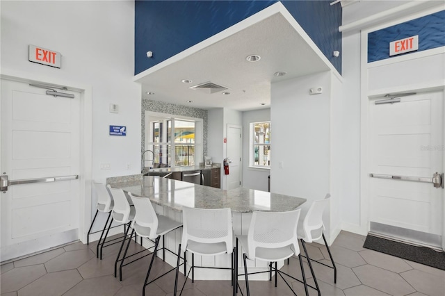 7793 Clove Hitch Way, Orlando, FL 32832 - tiled dining space featuring a sink and visible vents