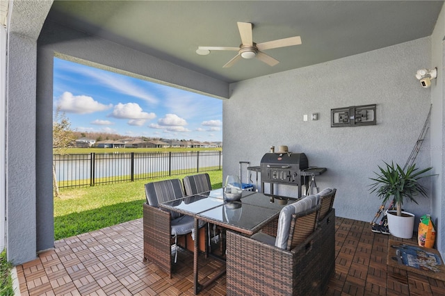 7793 Clove Hitch Way, Orlando, FL 32832 - view of patio with ceiling fan, outdoor dining area, a water view, fence, and grilling area