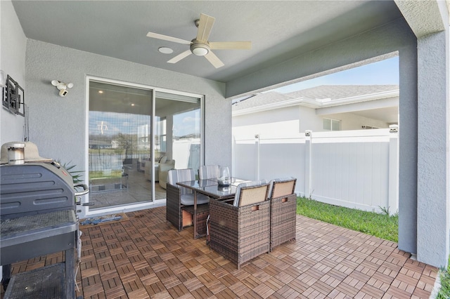 7793 Clove Hitch Way, Orlando, FL 32832 - view of patio featuring outdoor dining space, ceiling fan, and fence