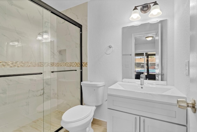 ensuite bathroom with a marble finish shower, ensuite bathroom, and a textured wall