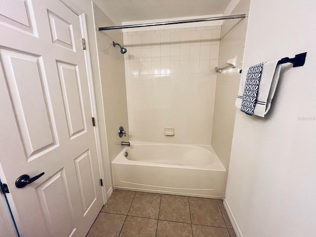 bathroom with tile patterned flooring, bathtub / shower combination, and baseboards