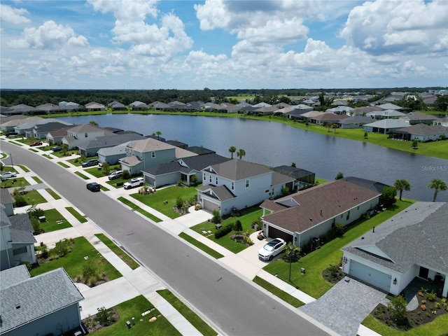 birds eye view of property featuring a water view and a residential view