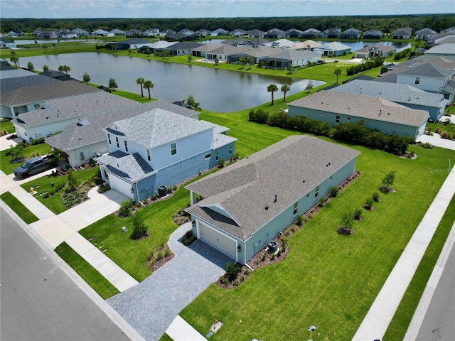 birds eye view of property with a water view and a residential view