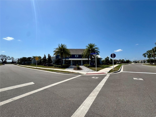 14552 Skipping Stone Loop, Parrish, FL 34219 - view of road with sidewalks, traffic signs, and curbs