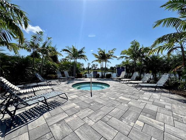 14552 Skipping Stone Loop, Parrish, FL 34219 - view of pool with fence, a patio, and a community hot tub