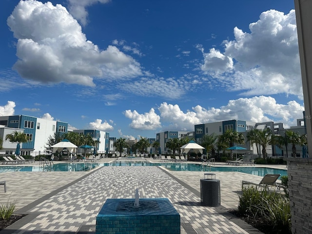 community pool with a patio area